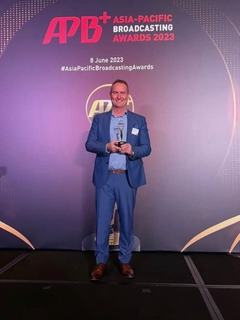 Silver Trak Digital COO, Christian Christiansen, collecting the 2023 Asia-Pacific Broadcasting+ Innovation Award for Cinema Direct 5G – Australia